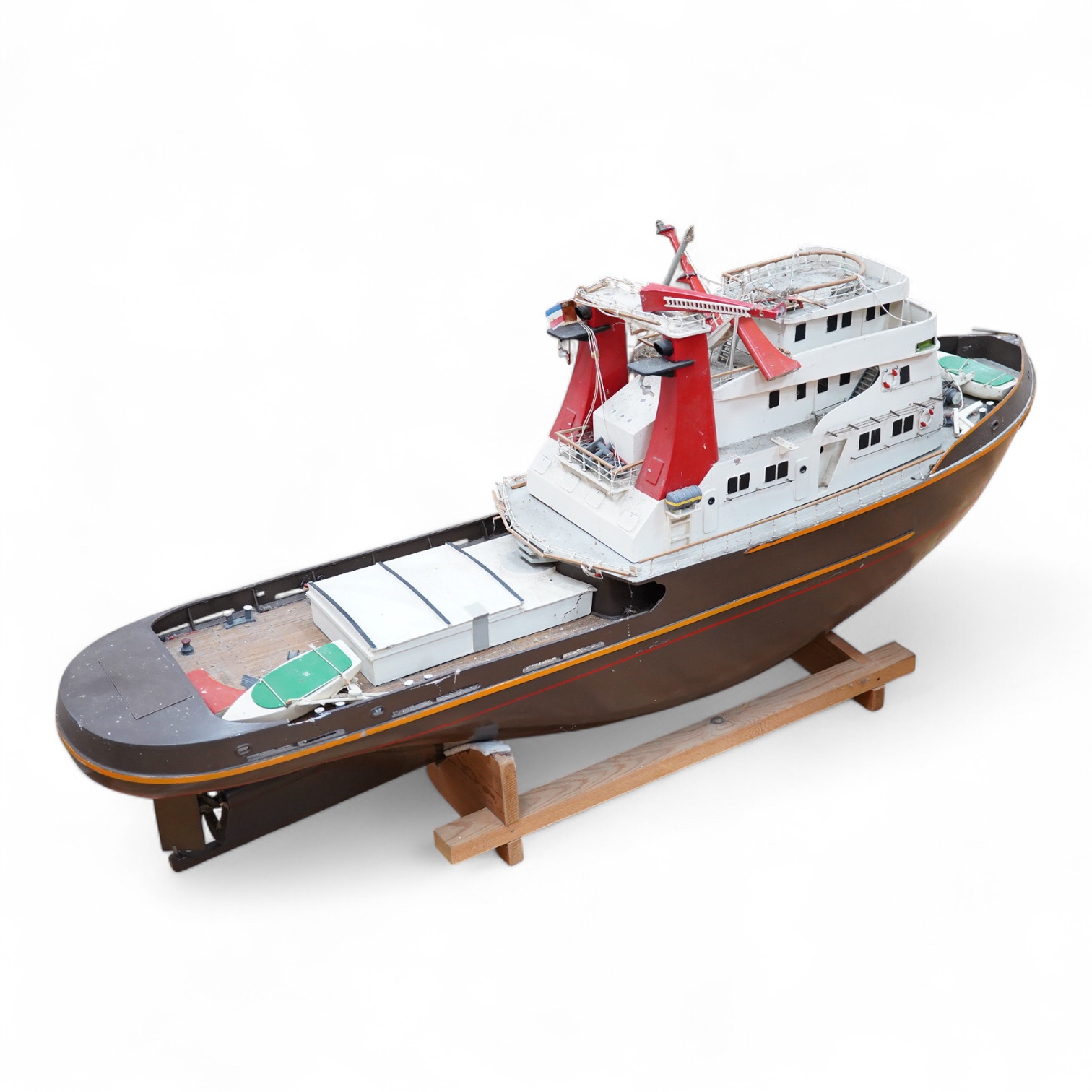 A model of the tugboat Amsterdam, probably built from a kit as a pond yacht, and powered by an electric motor, length of hull approx 103cm, of primarily painted wood construction